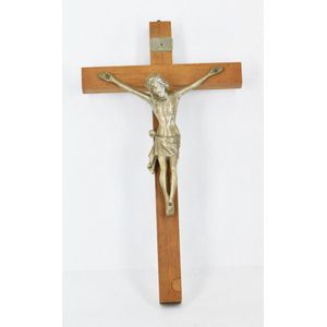 A religious crucifix, hollow silver Jesus on wood. Length 30 cm