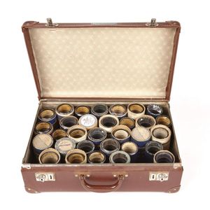 A brown Vulcanite suitcase containing Edison cylindrical…