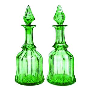 A pair of mid-Victorian faceted green glass large decanters,…