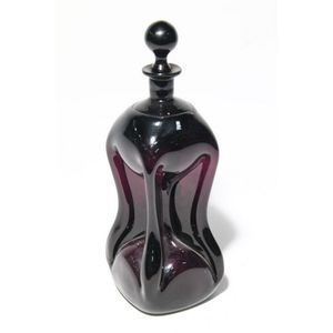 An antique amethyst pinch waisted decanter with original…