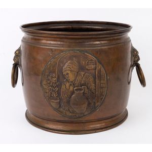 An antique coal bin, copper and brass with repousse panel…