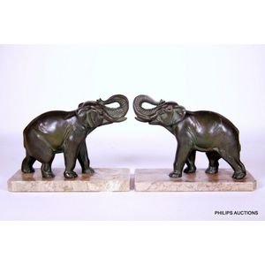 A pair of Art Deco patinated spelter and marble elephant…