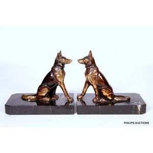 A pair of signed Art Deco spelter and marble Alsatian bookends,…