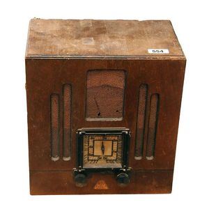 An Art Deco mantel radio, maker A.G.E band master. 28 cm high.