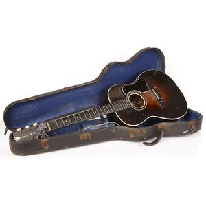 An old American Acoustic Martin Coletti Guitar in a case, C.…