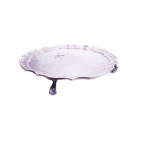 Small silver salver. With pie crust edging and four claw balled…