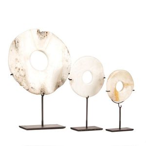 Three Melanesian discs of Tridacna shells (Tridacna gigas),…