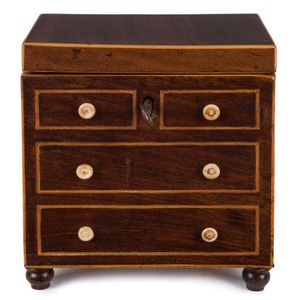 An English Georgian tea caddy in the form of a chest of drawers,…
