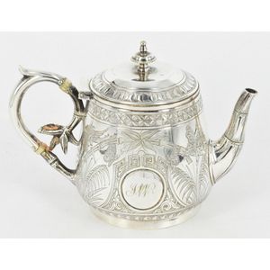 A silver plated tea pot, well decorated with butterfly, bamboo,…