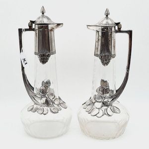 Pair of WMF Art Nouveau claret jugs, silver plated over crystal,…