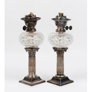 A pair of silver plate mounted cut glass oil lamps, English,…