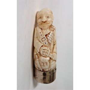 A sperm whale tooth carved snuff mull as a Scottish gent with…