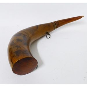 A 19th century scrimshaw powder horn, fashioned from an oxen…