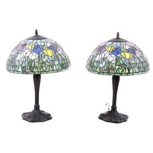 A pair of Tiffany style lamps, in the Art Nouveau style, each…