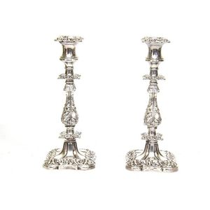 A pair of early 20th century Sheffield plate candlesticks, with…