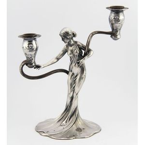 A fine Art Nouveau WMF candlestick in the form of a Grecian…