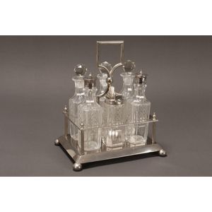 English silver plate and crystal cruet set, comprising three…