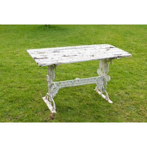 A vintage garden table, cast metal and timber with white…