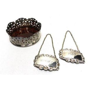A Topazio silver plate wine bottle coaster with faux tortoise…