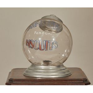 A vintage glass Arnott's Biscuit globe, with aluminium cover…