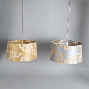 A pair of modernist style light pendants, with large fabric…