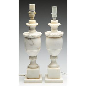 A pair of carved marble table lamps on plinth bases, height 46…