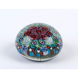 A millefiori glass paperweight, 20th century, 4.5 cm high, 8 cm…