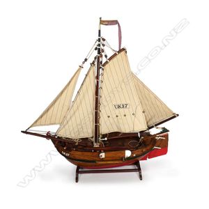 A vintage model 'UK37' herring sail boat, of teak laminated…