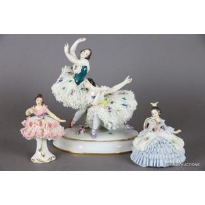 A Dresden porcelain lace ballerina group and two complementary…