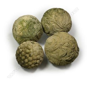 Four small church stone medieval style garden balls, varying…