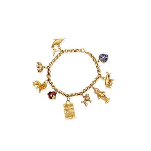 A gold charm bracelet, the belcher link bracelet hung with nine…