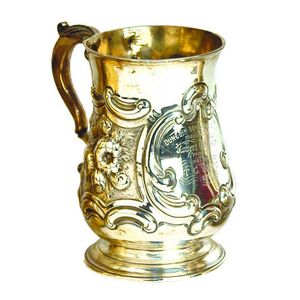 A Victorian silver baluster mug, heavy embossed C-scroll…