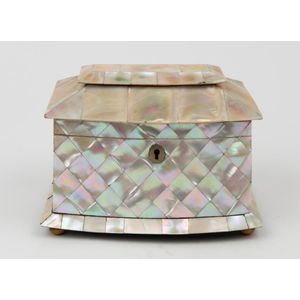 A Georgian mother of pearl tea caddy, with bone handled lidded…