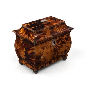 A Victorian tortoiseshell tea caddy with engraved silver…
