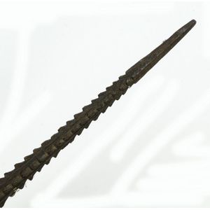 A long old Melanesian fishing spear, with plain circular shaft…