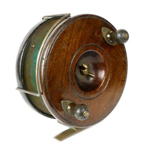 Sold at Auction: Two vintage fishing reels, one walnut and brass