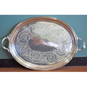 A silver plated large tray, oval shaped, double handles,…