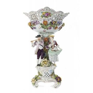 A Dresden floral porcelain encrusted figural centrepiece, 19th…
