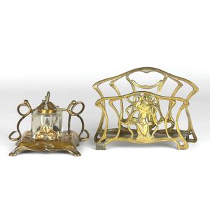 A brass Art Nouveau letter rack, in the manner of WMF and an…