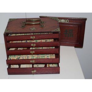 A Chinese Mahjong set, early 20th century, with bone and bamboo tiles,  contained within a five drawe