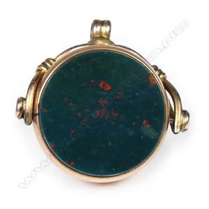 A 9ct rose gold spinner, with bloodstone and carnelian. 9.6gms.