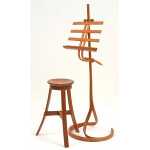 A mid 20th century bentwood music stand and stool designed by…