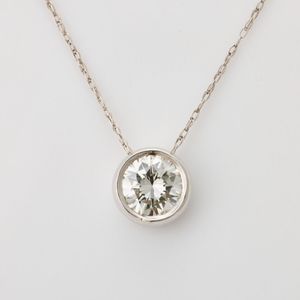 A 9ct white gold pendant featuring a round, brilliant cut&hellip;