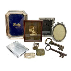 A collection of silver plate frames, card cases & pill boxes