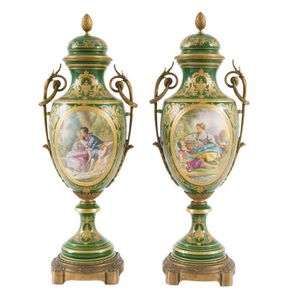 A pair of decorative French porcelain lidded urns, late 19th…