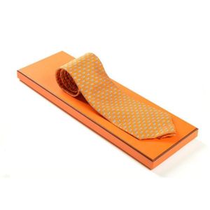 A silk tie by Hermes, styled with grey dolphins, on an orange&hellip;
