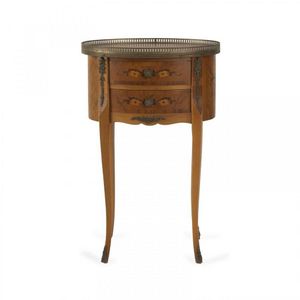 A small oval drum shaped side table c. 1920, with two drawers…
