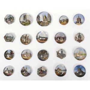 A collection of twenty souvenir paper weights, circa 1910, of…