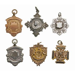 A collection of six sterling silver medallions including, Queen…