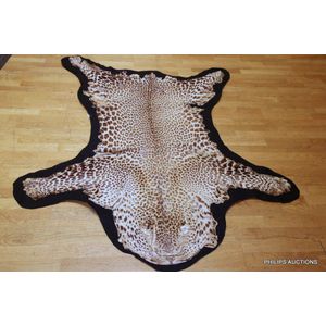 An antique leopard skin rug (Panthera Pardus), the skin mounted…